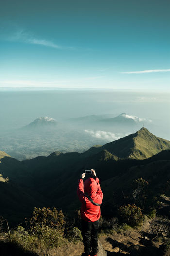 A man taking pictures on mount merbabu, central java