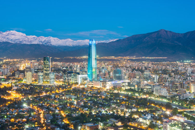 Skyline of santiago de chile at the foots of the andes mountain range and buildings at providencia.