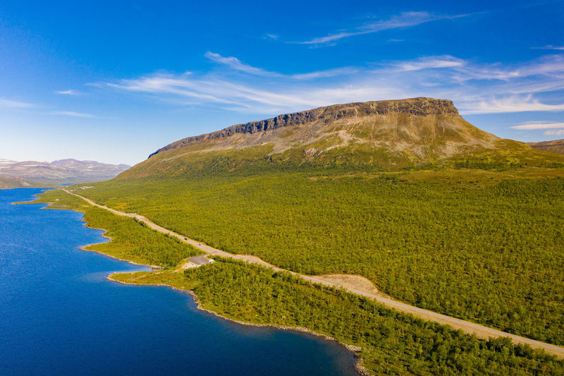 Aerial view of saana mountain, lake, road and forest in kilpisjärvi, finland