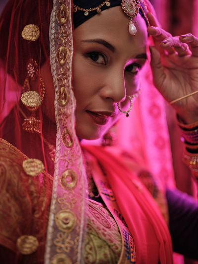 Portrait of young woman in traditional clothing