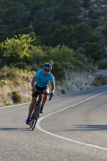 Man riding a bicycle on a costa blanca mountain road
