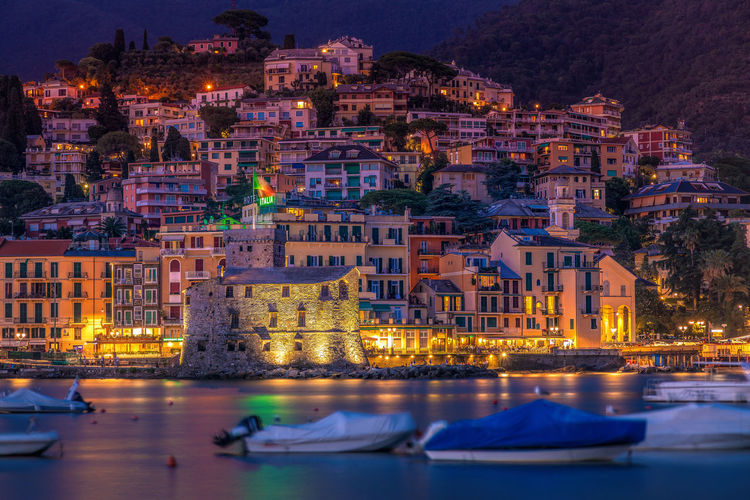 Panoramic view of rapallo town after sunset, liguria, italy