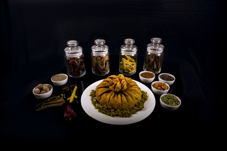 High angle view of food served on table against black background