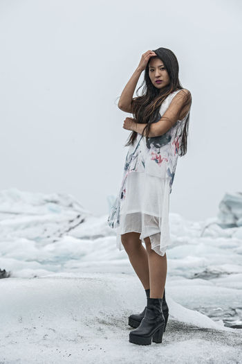 Beautiful woman posing for fashion photoshoot at glacierlagoon