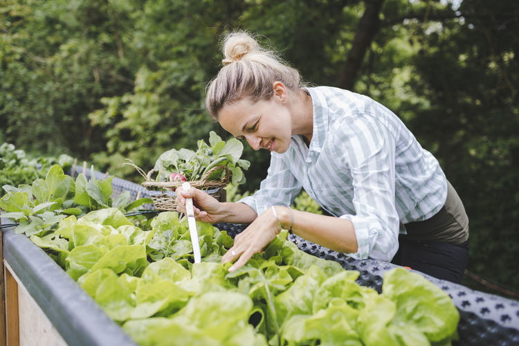Woman holding food on plant