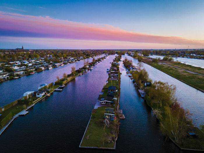 High angle view of river against sky at sunset