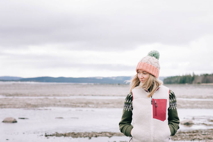 Portrait of woman standing alone in the great outdoors in sweden