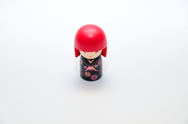 High angle view of red toy against white background