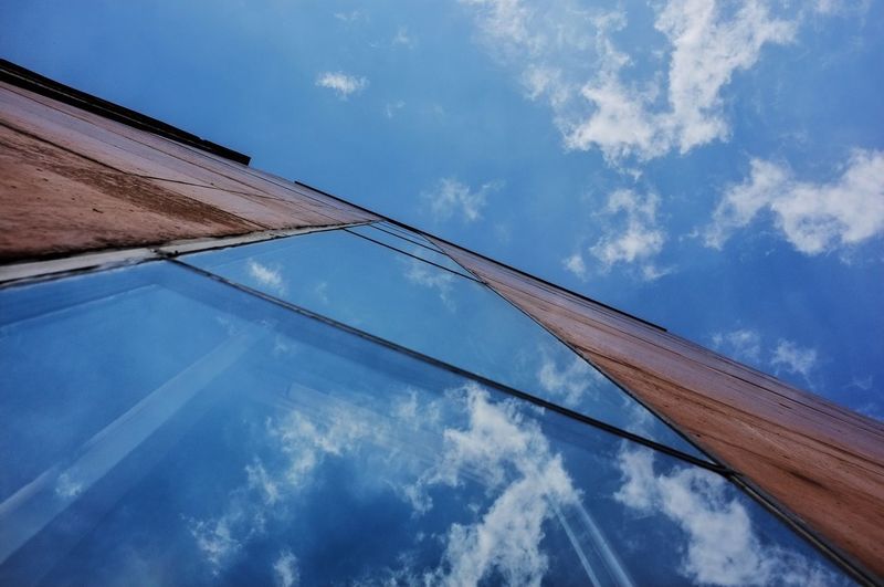 Low angle view of built structure against blue sky
