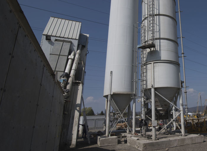 A bulk material silo for storing sand in construction industry
