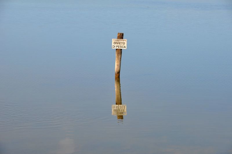 View of sign on a lake