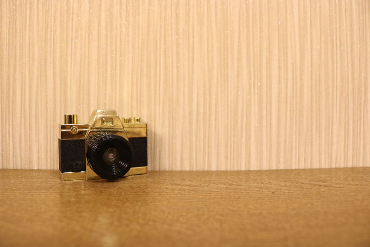 Close-up of old camera on table
