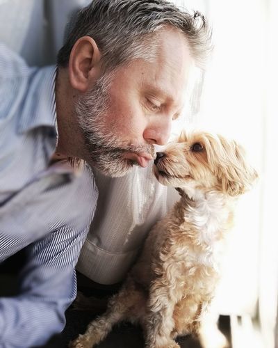 Side view of man with dog