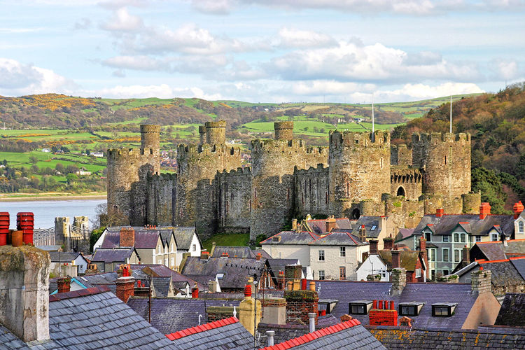 Across the rooftops and buildings towards conwy castle, wales