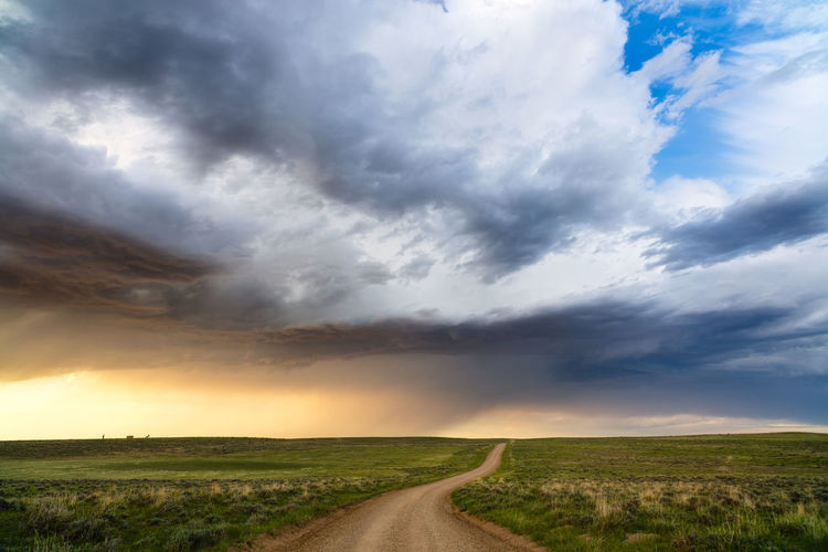 Scenic landscape with rolling hills and storm clouds in thunder basin national grassland.