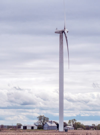 Low angle view of wind turbine against sky on a rural farm