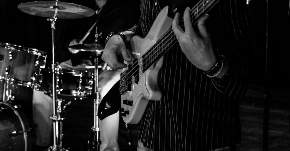 Tilt image of playing guitar at night
