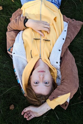Portrait of boy lying on grass