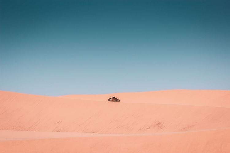 Scenic view of desert against clear sky