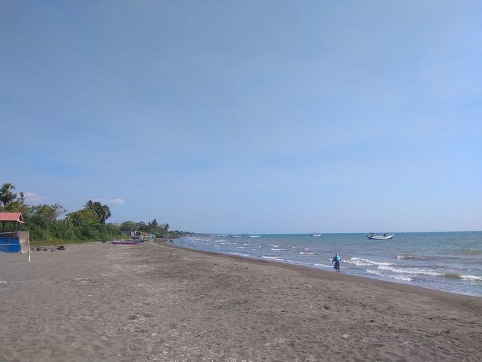 Scenic view of beach against sky