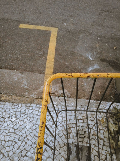 High angle view of arrow sign on street