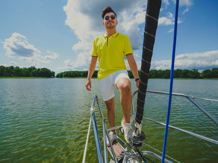 Portrait of man standing in boat