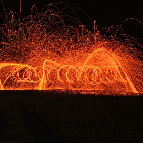 Light painting at night with fire wool