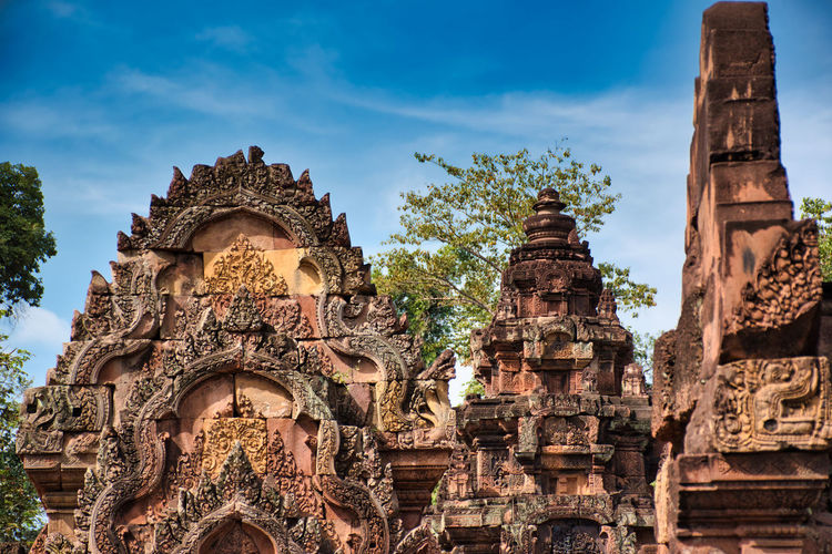 Banteay srei or banteay srey temple site among the ancient ruins of angkor wat hindu temple complex