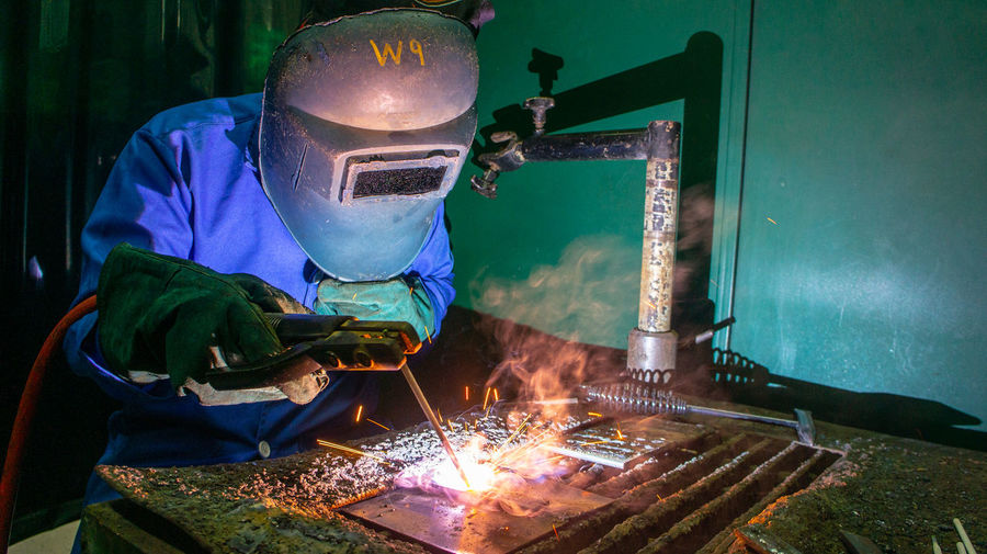 Man working on metal in workshop