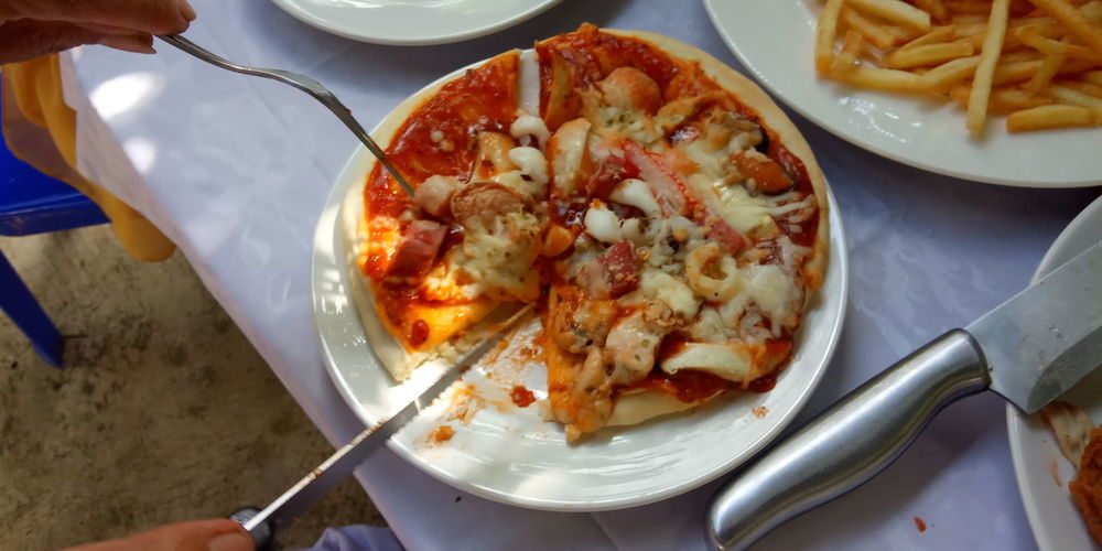 High angle view of pizza served in plate