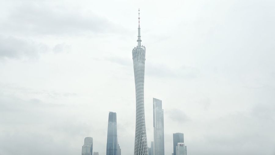 Low angle view of building against cloudy sky