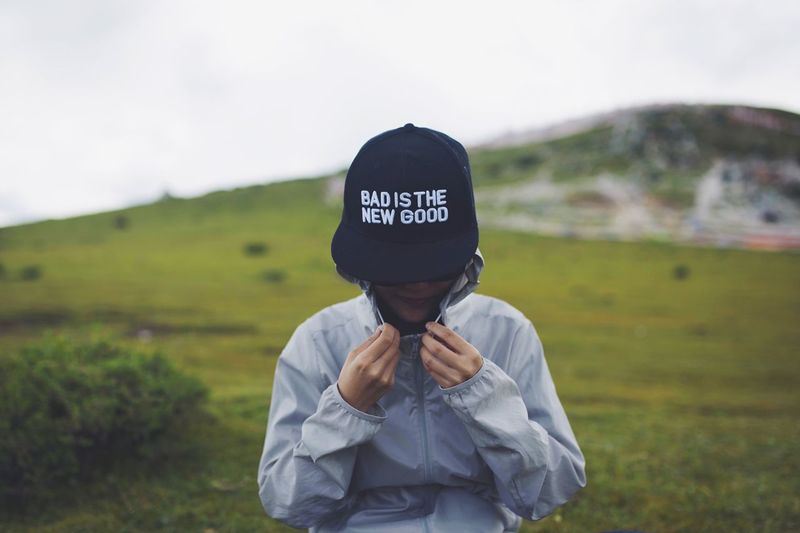 Girl wearing hat on landscape