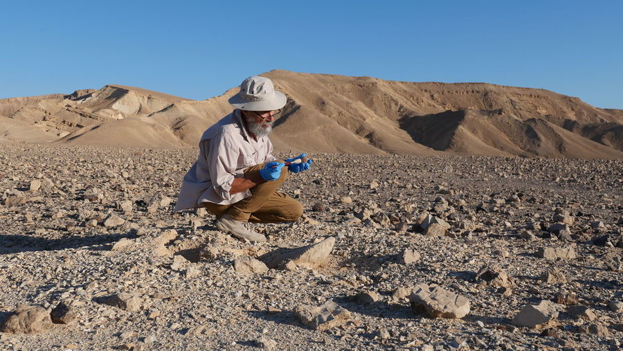 Archaeologist at work in the desert 