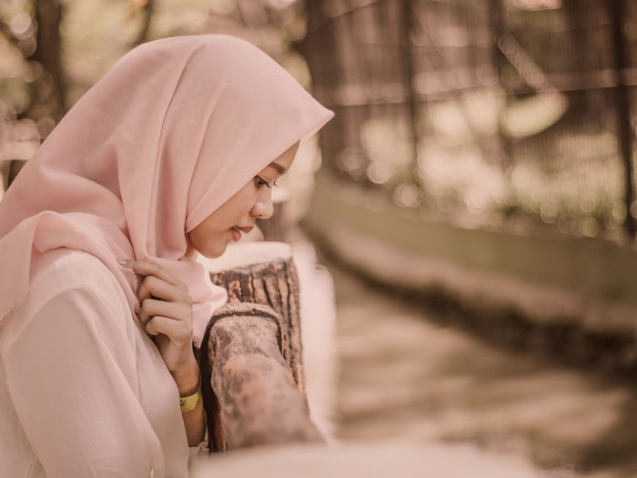 Side view of young woman wearing hijab