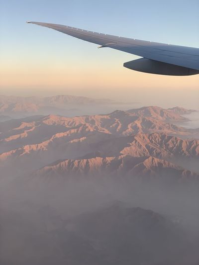 Aerial view of mountain against sky during sunset