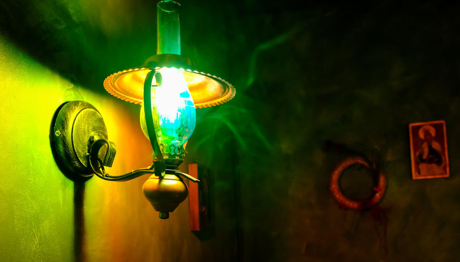 Low angle view of illuminated electric lamp