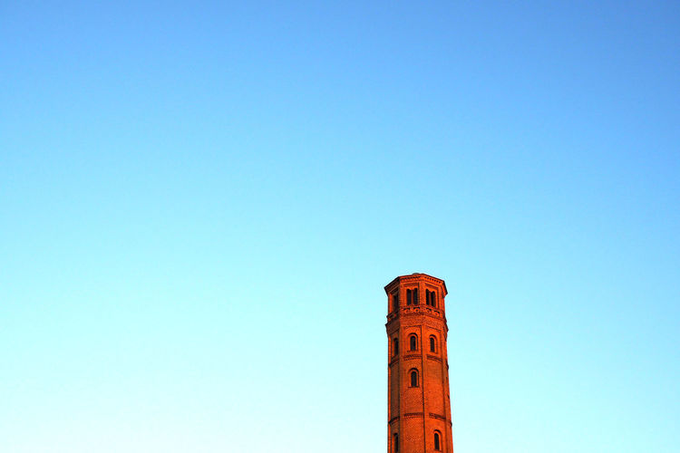 Low angle view of historic tower against clear sky