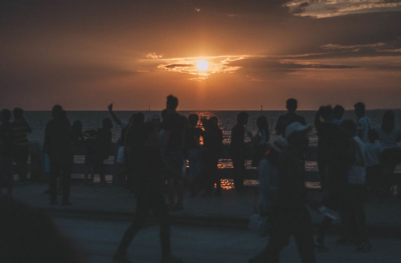 Group of people at sunset