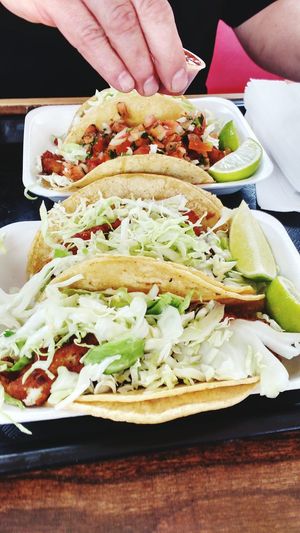 High angle view of tacos served in plate at restaurant
