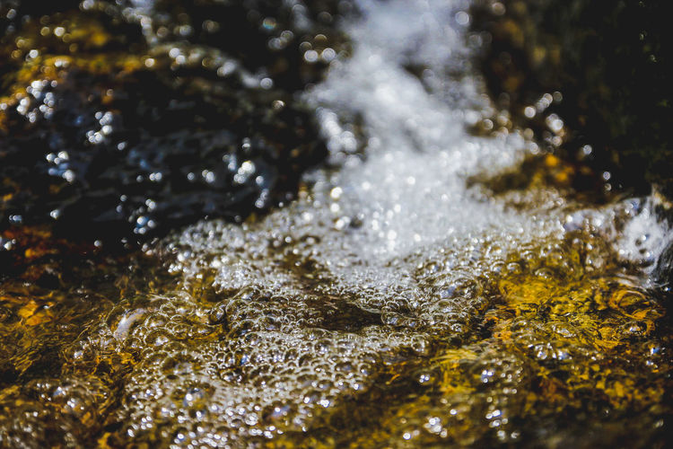 Close-up of water flowing through rocks