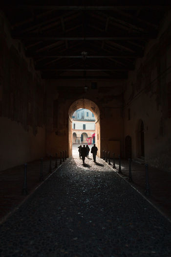 Mantua, italy. rear view of people walking in building