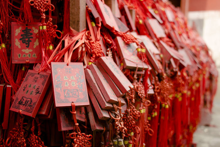 Red prayer blocks hanging at temple