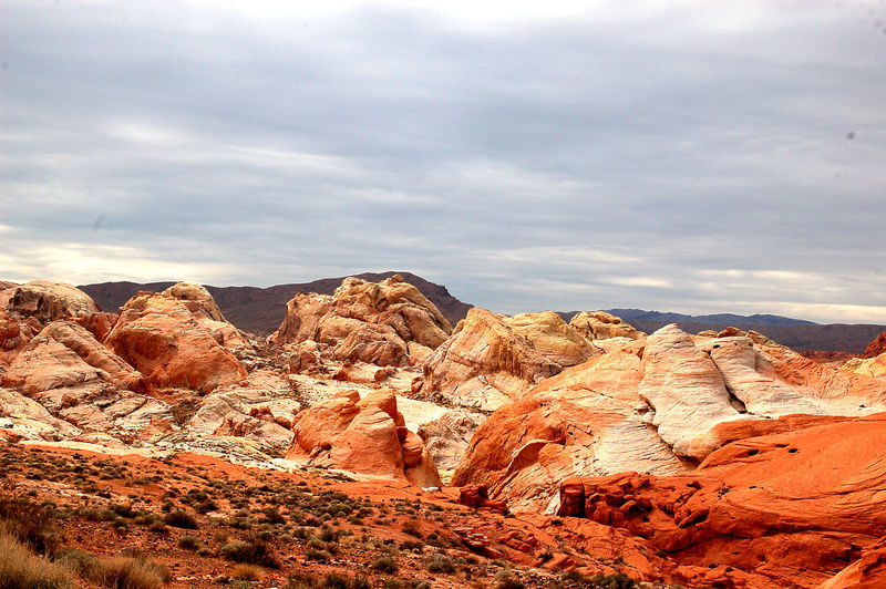 Rock formations at red rock canyon national conservation area against cloudy sky