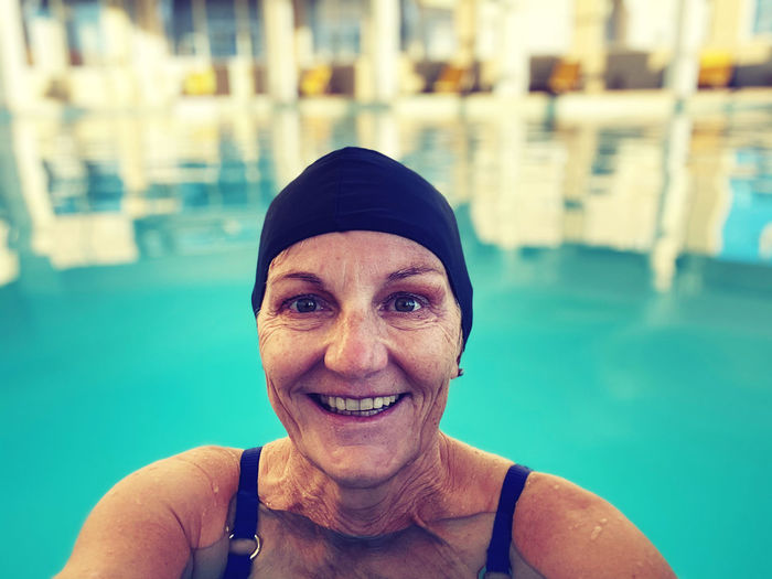 Portrait of a smiling women in swimming pool 