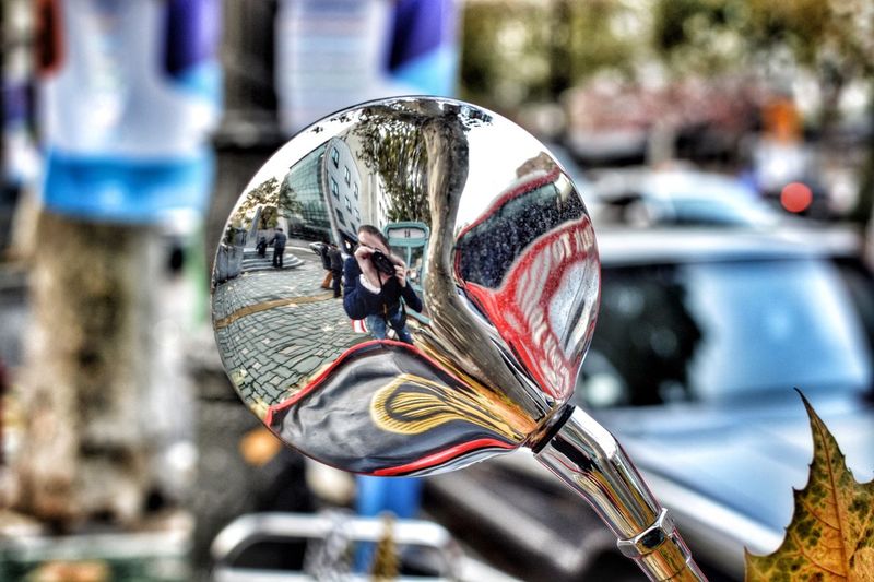 Close-up of motorcycle mirror