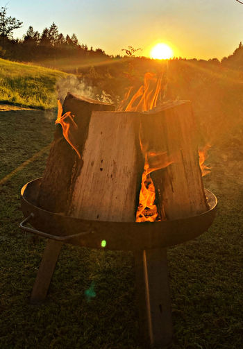 High angle view of fire pit at sunset