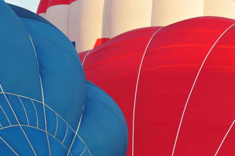 Close-up of hot air balloon against blue sky