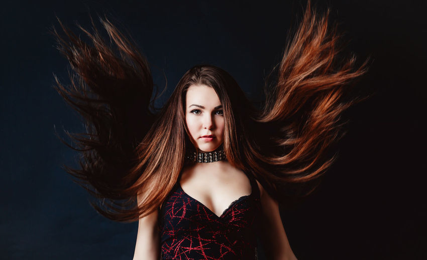 Portrait of young woman with long hair