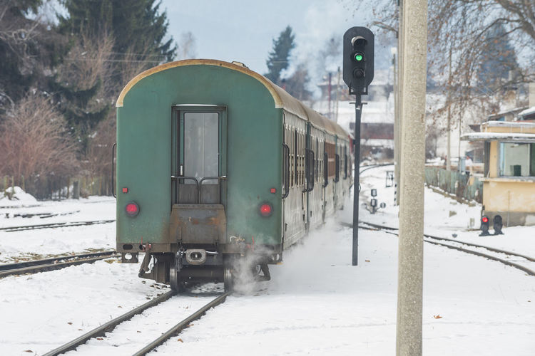 Train on railroad tracks during winter
