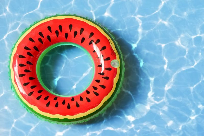 Close-up of inflatable ring floating on swimming pool